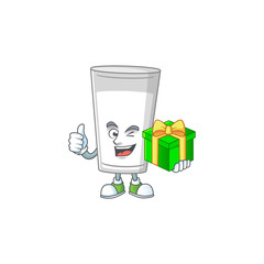 Smiley glass of milk cartoon character holding a gift box