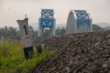 railroad edge with twin bridge background
