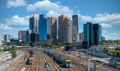 Trains taveling in and out of the city of Melbourne, Australia.