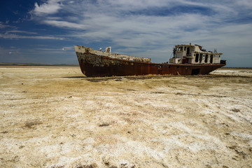 Old fishing schooner at the bottom of the dried Aral Sea