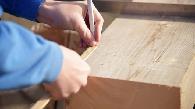 Draw markings on wood with a meter stick