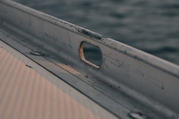 close up deck of sailboat at sunset. Yachting concept and sea background.