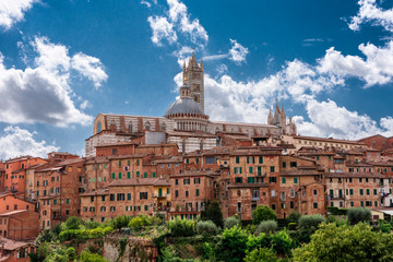 Obraz premium panorama of Tuscany town, Italy, with vivid colors and beautiful clowds on blue sky