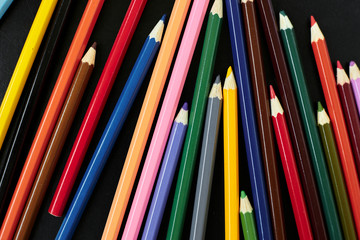 A pencil next to a book shelf