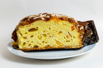Panettone, Italian Christmas bread, with a brioche-like dough infused with a vanilla bean and studded with rum-soaked raisins and candied orange peel