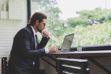 Business caucasian men working from home. Handsome man work in modern office. Concept of business, technology and meeting online.