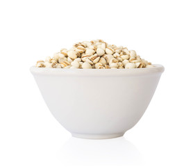 Job's tears in ceramic bowl on white background, healthy food concept