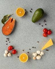 Healthy food with low carb content, on a gray table. The concept of a ketogenic diet, health and youth. Ingredients of the keto diet, protein food. The view from the top. Space for copying.
