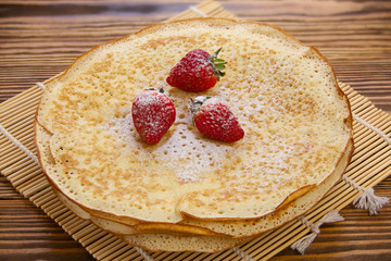 Plate with pancakes on table top view