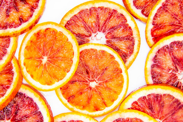 Sicilian sliced ​​orange on a white plate on a white background. Sliced ripe Sicilian oranges...