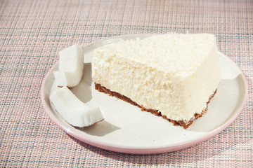 delicious cheesecake with coconut on  plate