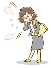 ハンカチで口を押えて咳をするスーツ女性