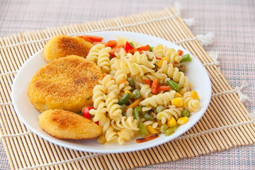 vegetables gorse or tomatoes corn peas bell peppers carrots on plate