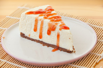 delicious cheesecake with strawberries on  plate