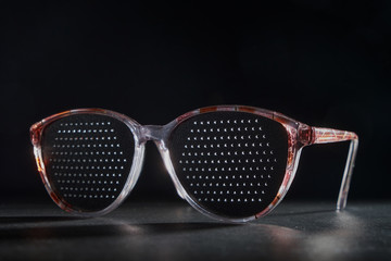 Training glasses isolated on a black background, front view