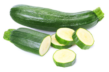 fresh green zucchini with slices isolated on white background.
