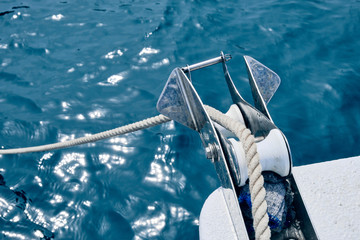 Bow of the sail boat with anchor rope. Sailing at summer sunny day. Yachting concept and sea background © Evgeniy