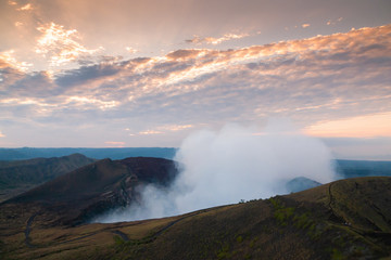 Volcano crater smoking at sunset in Nicaragua