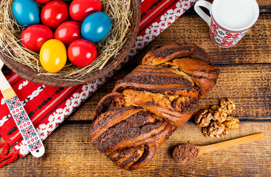 Traditional Romanian Easter table with cozonac and pasca meaning Sweetbread and Matzo an unleavened flatbread that is part of Jewish cuisine and forms an integral element of the Passover. Happy Easter