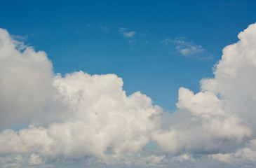 Naklejka na ściany i meble Fluffy White Clouds with Clear Blue Sky