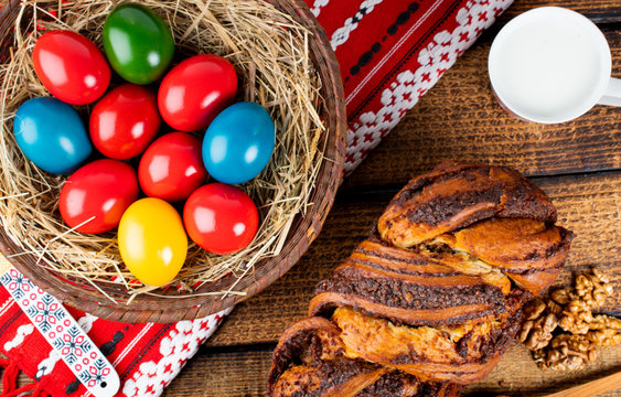 Traditional Romanian Easter table with cozonac and pasca meaning Sweetbread and Matzo an unleavened flatbread that is part of Jewish cuisine and forms an integral element of the Passover. Happy Easter
