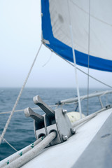 Fototapeta premium closeup white line in stopper of sailboat at foggy summer day. Yachting concept and sea background