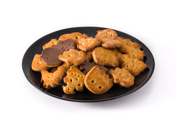 Halloween cookies on black plate isolated on white background