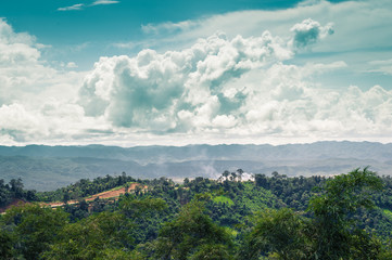 Fototapeta premium Landscape of mountain green forest and clouds sky