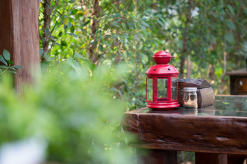 closeup of red lantern on wood table