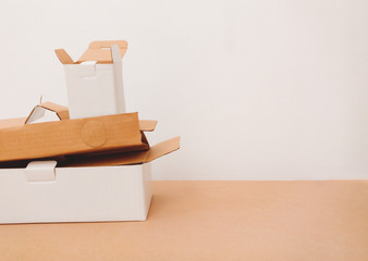 photo of waste paper and plastic, pile of cardboards for recycling, copyspace for text. Zero waste concept, trash recycling, garbage sorting. Earth day