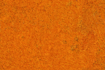 Seamless texture of bright orange rust on metal sheet