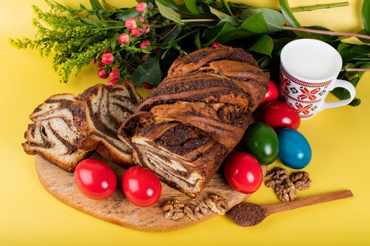 Traditional Romanian Easter table with cozonac and pasca meaning Sweetbread and Matzo an unleavened flatbread that is part of Jewish cuisine and forms an integral element of the Passover. Happy Easter
