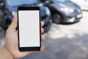 Cropped shot view of man hand holding smartphone outdoor with blank copy space screen for text message or information content