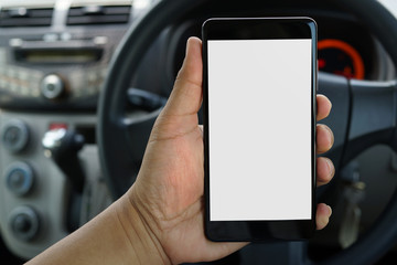 Cropped shot view of man hand holding a smartphone inside car with blank copy space screen for text message or information content