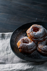 Delicious donut image.
Sprinkled powdered sugar on donuts.

