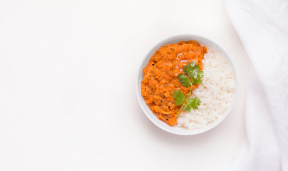 Dhal traditional Indian dish in a bowl with rice on a white background. Copy space