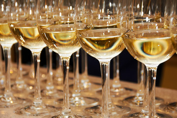 Glass glasses of alcoholic champagne and wine in a restaurant for a holiday, romantic date or wedding