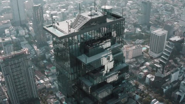 Aerial view of Sathorn district, Chong Nonsi, King Power Mahanakhon tower and skywalk in Bangkok, Thailand