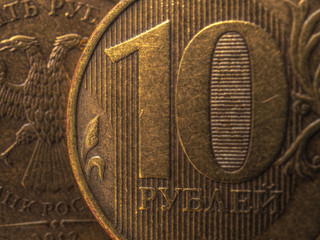 Russian coins 10 rubles, fragment very close-up. Central Bank of Russia, refinancing rate. Bank, deposit, loan, savings, interest rate. Aged effect shot. Focus on floral ornaments. Macro
