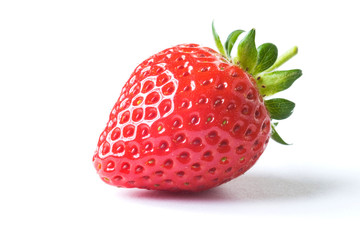 Fresh ripe red strawberry with green leaves on white background with dropped shadow. Studio shot