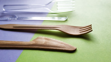 Contrast plastic and bamboo wooden fork knife. Eco-friendly disposable cutlery