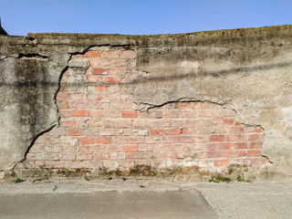 Creepy brick wall of an old warehouse