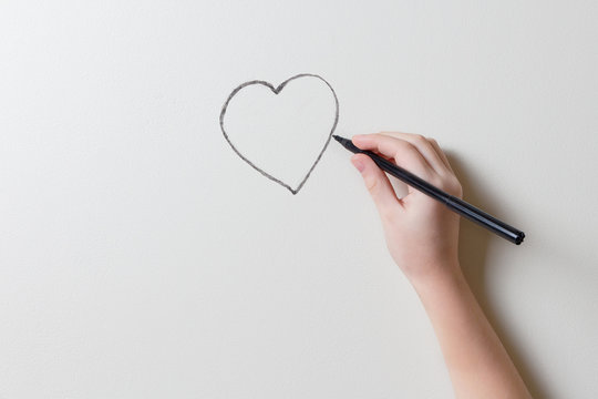 drawing a heart on the wall