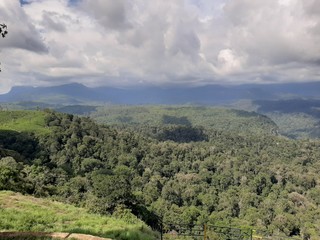 Fototapeta na wymiar Beautiful Forest, Mountains, dam , tea plants, and sky view from valparai and snehatheeram beach