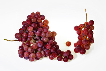 Two Bunches of fresh wine pink grapes falling on a white background in a back light big size high resolurion