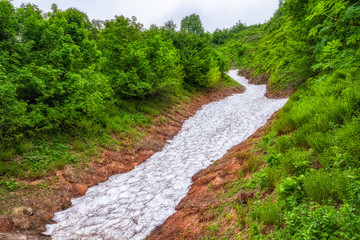 A layer of melting snow in high mountains.