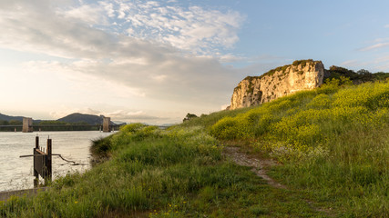 end of the day on the banks of the Rhone with a view of the cliffs of Donzere, France