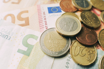 Euro bills and coins, financial Corona Virus crisis.