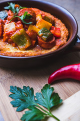 Fresh potato pancakes with vegetables served in a pan, traditional in Polish and Hungarian cuisine