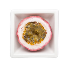 Purple passionfruit in a square bowl isolated on white background; ; 
